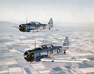 300px-AT-6C_Texans_in_flight_1943.jpg