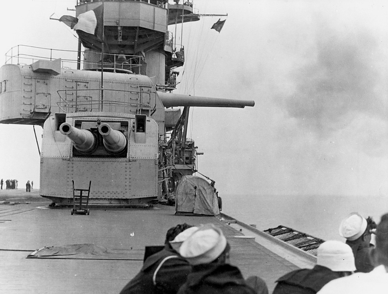 1280px-USS_Remembrance_(CV-2)_firing_203mm_guns_1928.jpg