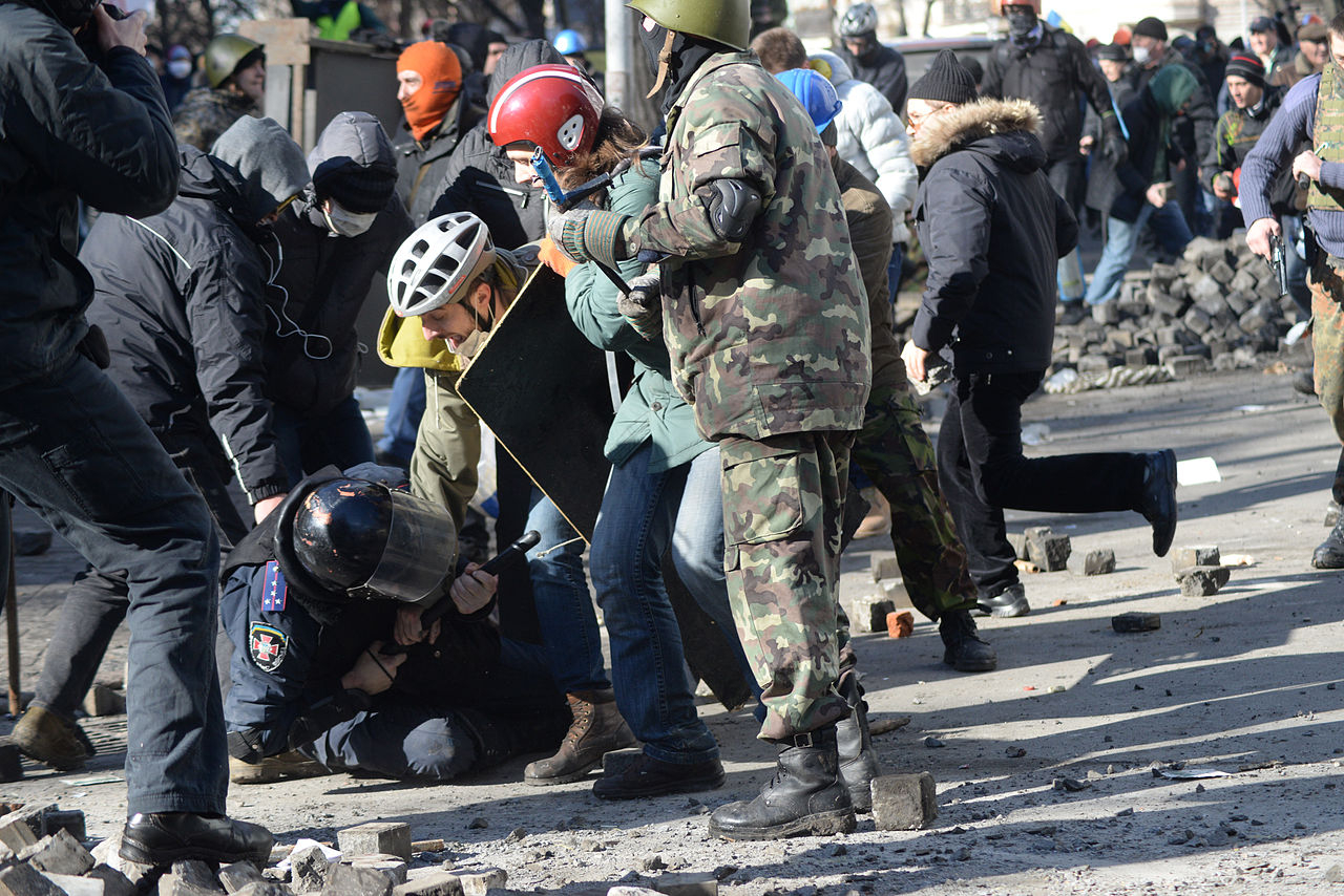 A riot police officer is thrown to the ground during clashes in Kyiv, Ukraine. Events of February 18, 2009.