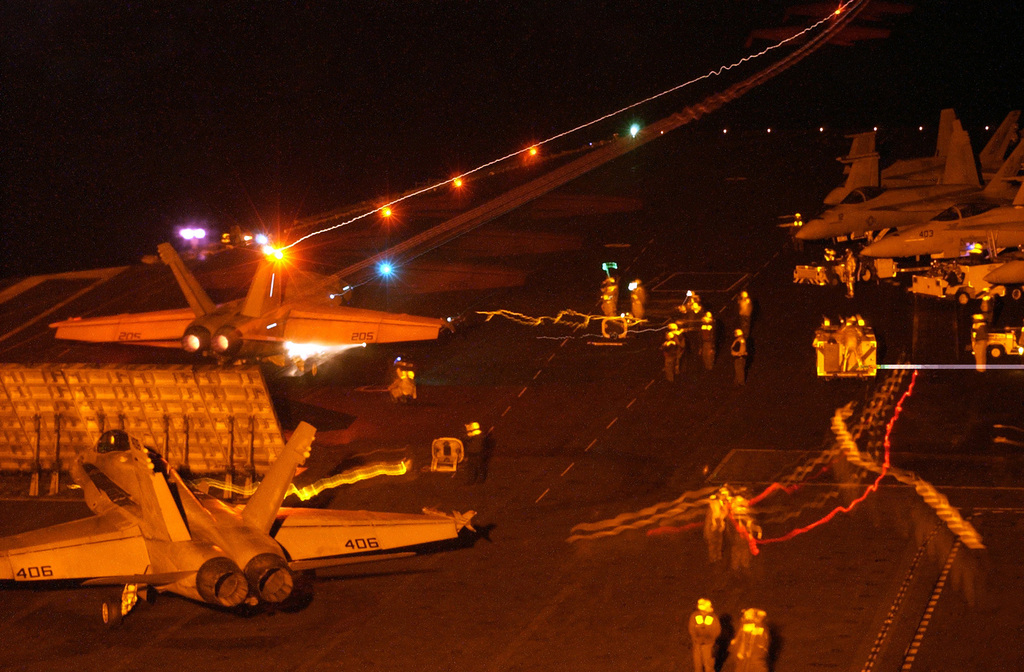 a-us-navy-fa-18e-super-hornet-aircraft-lights-up-the-night-as-it-launches-from-325463-1024.jpg