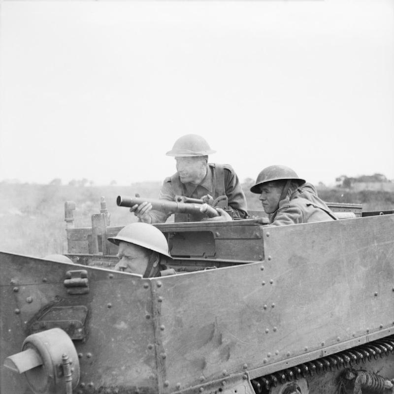 A_Universal_Carrier_crew_of_the_2nd_Sherwood_Foresters_fire_a_2-inch_mortar_from_their_vehicle...jpg