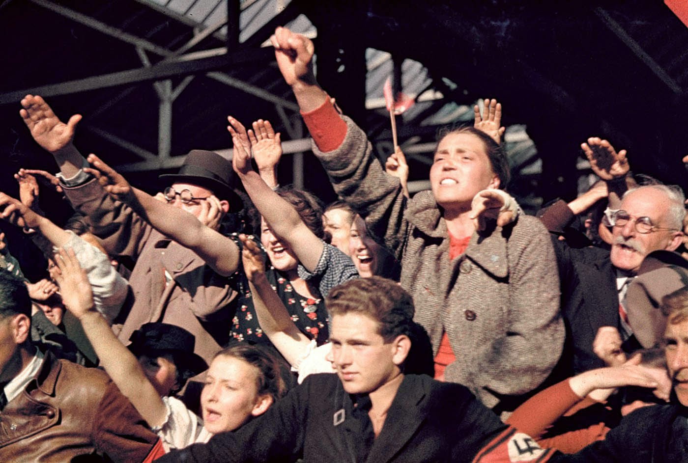 Crowds cheering Adolf Hitler’s campaign to unite Austria and Germany, 1938..jpg