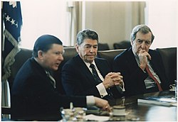 Photograph_of_President_Reagan_receiving_the_Tower_Commission_Report_in_the_Cabinet_Room_-_NAR...jpg