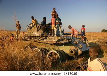 stock-photo-children-playing-on-tank-in-minefield-in-kuito-angola-1618035.jpg