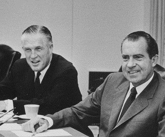 Nixon_and_Romney_in_a_cabinet_meeting.jpeg