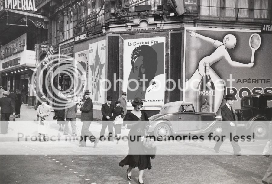 Parisianswalkonthestreetpastlotteryandvermouthadvertisementsin1935_zpsb80b5c0e.jpg