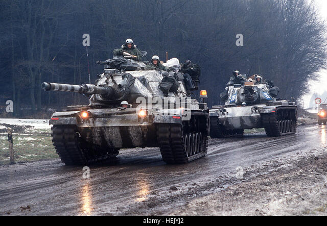 two-m-60a3-main-battle-tanks-move-along-a-road-during-central-guardian-hejyj2.jpg