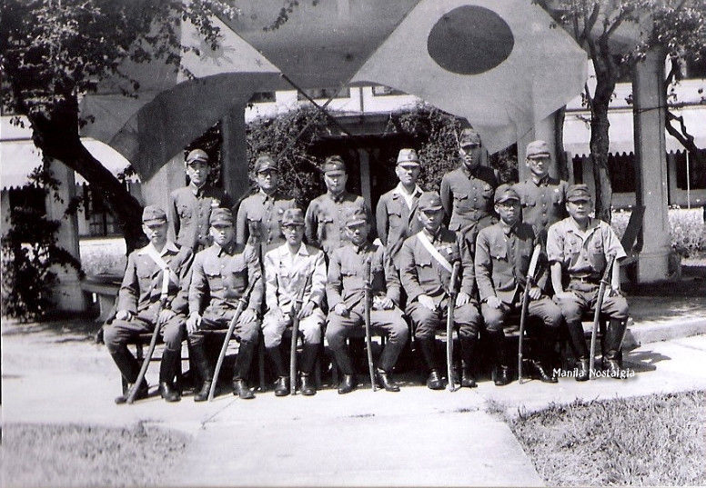 Jap-soldiers-pose-with-flags-logo.jpg