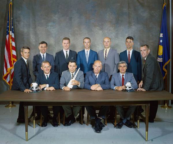 Group 6 astronauts. Back row, L-R: Henize, England, Holmquest, Musgrave, Lenoir. Front row, L-R: Chapman, Parker, Thornton, Llewellyn. Flanking the group are Allen (left) and O'Leary (right).